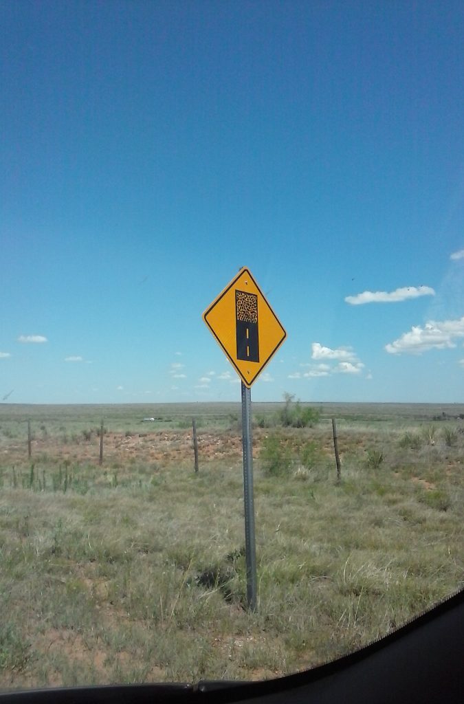 The sign is in New Mexico, looking west.